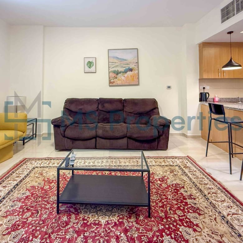 Elegant 1BR Apartment with Balcony | Prime Location