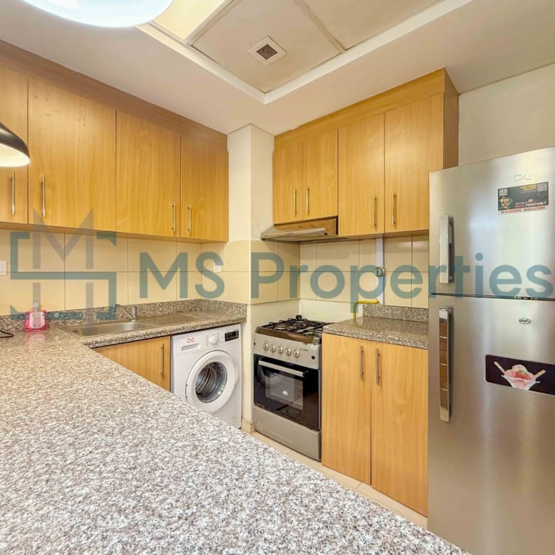 Elegant 1BR Apartment with Balcony | Prime Location