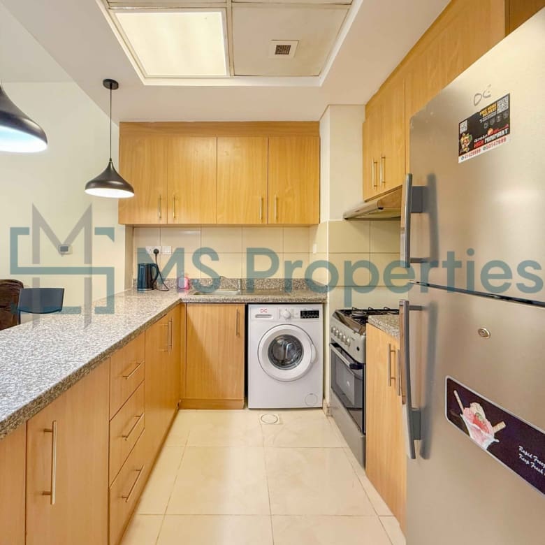 Elegant 1BR Apartment with Balcony | Prime Location